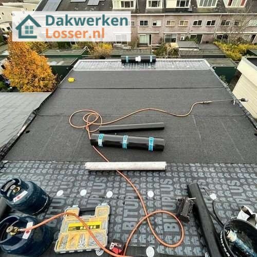 Plat dak Losser opnieuw leggen